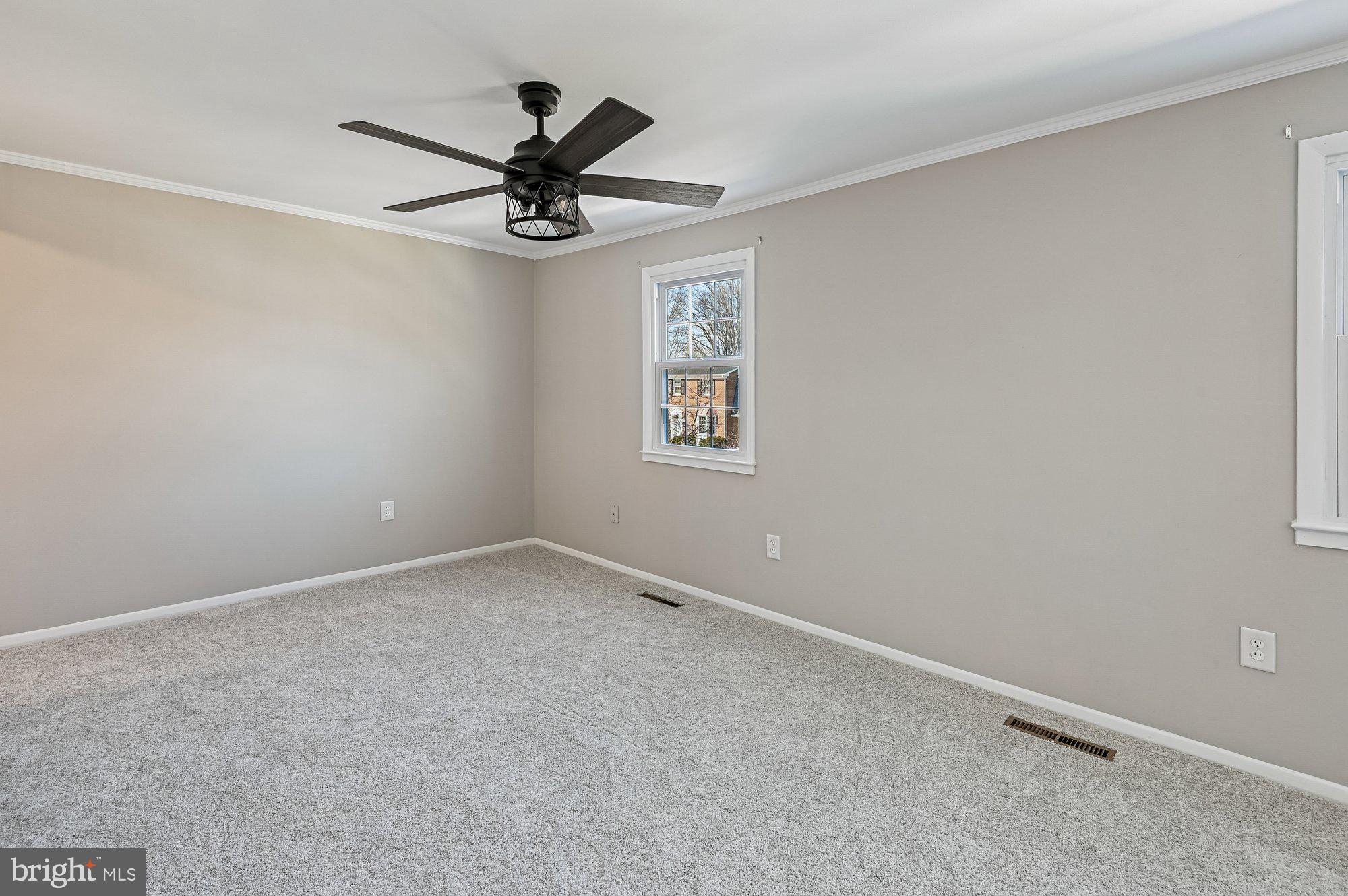 1753 Castleford Square Crofton, MD 21114 - Photo 16 of 30 an empty room with a window and a fan
