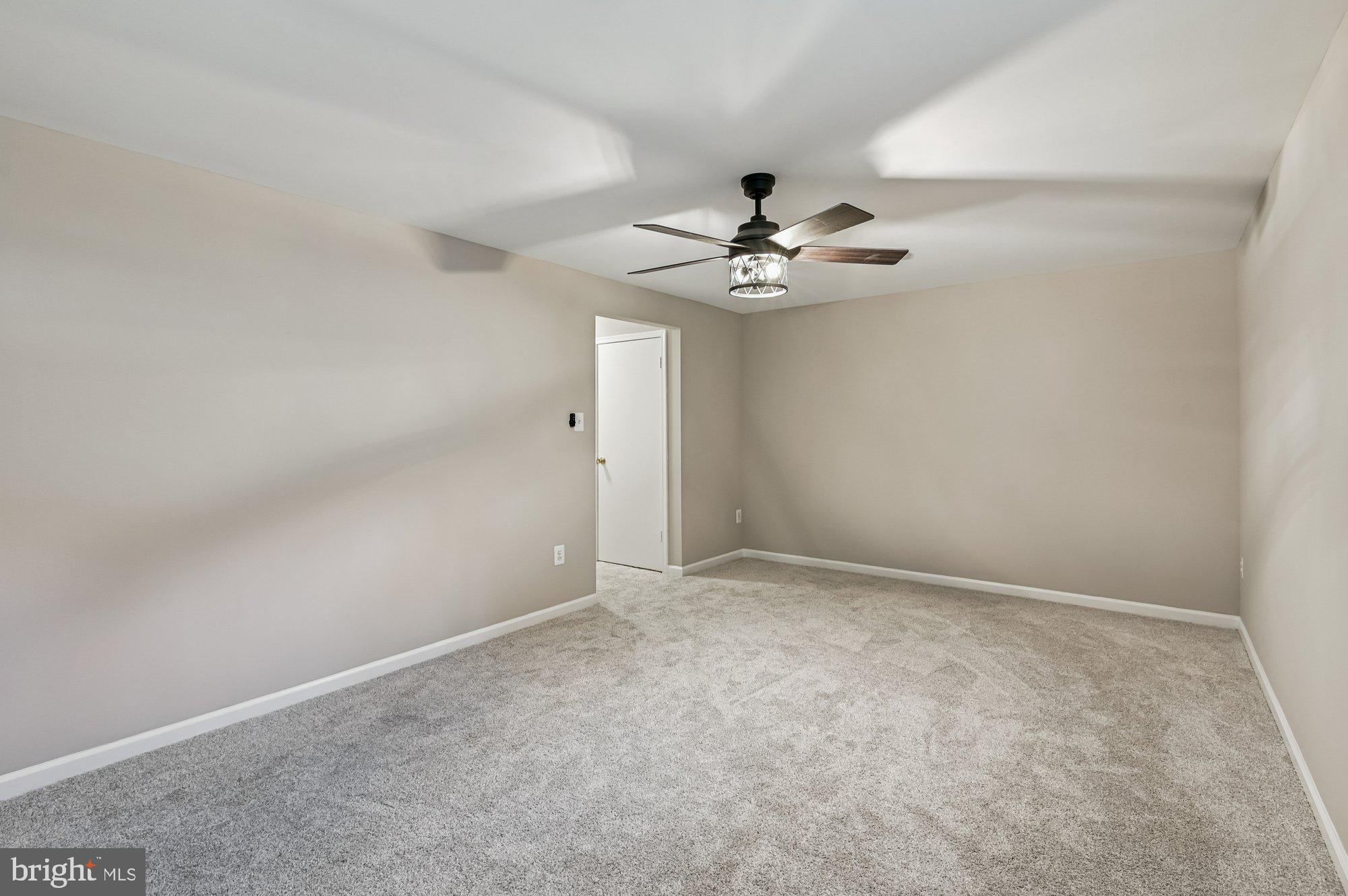 1753 Castleford Square Crofton, MD 21114 - Photo 28 of 30 a view of an empty room with a ceiling fan