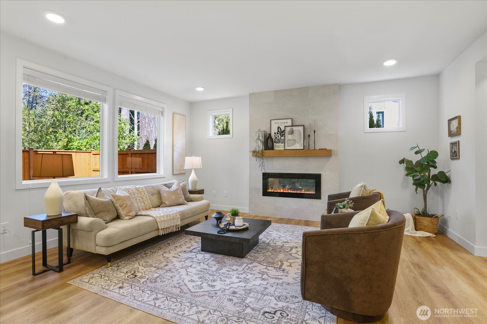 121 171st Place Southwest, Unit B Bothell, WA 98012 - Photo 5 of 36 a living room with furniture and a fireplace