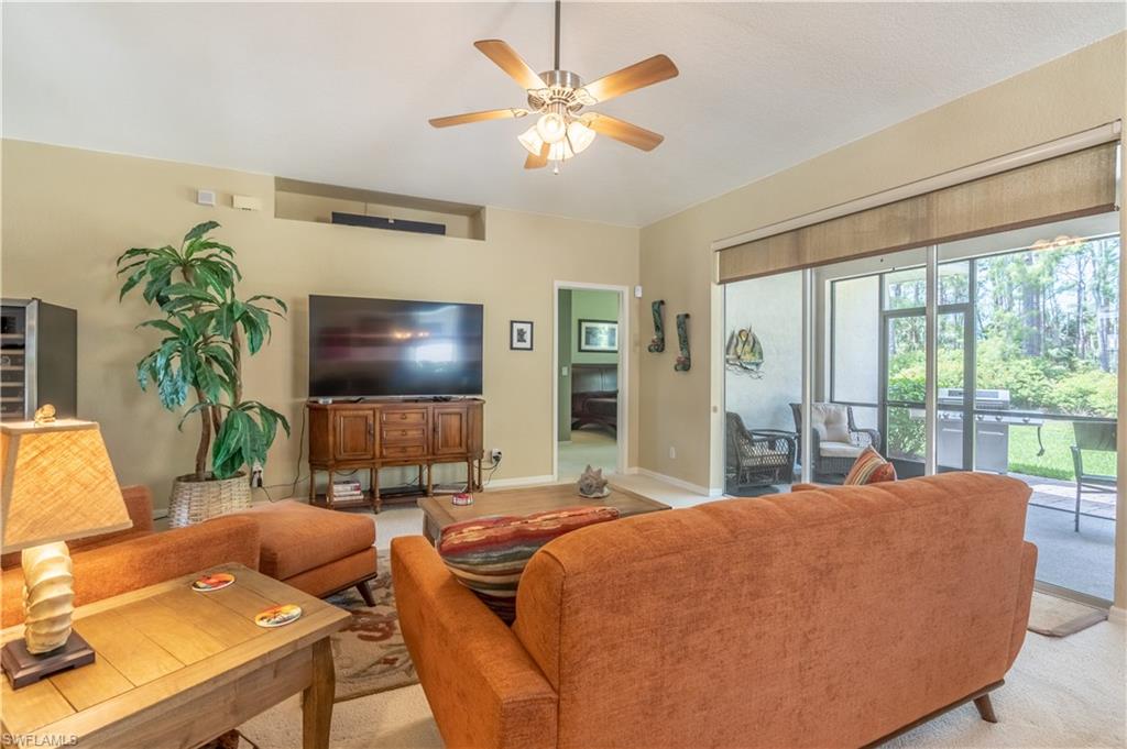 749 Crossfield Circle Naples, FL 34104 - Photo 14 of 37 a living room with furniture and a flat screen tv
