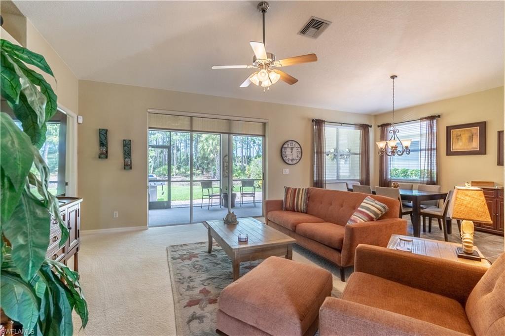 749 Crossfield Circle Naples, FL 34104 - Photo 17 of 37 a living room with furniture and a large window