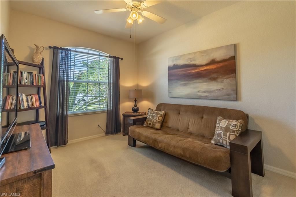 749 Crossfield Circle Naples, FL 34104 - Photo 18 of 37 a living room with furniture and a flat screen tv