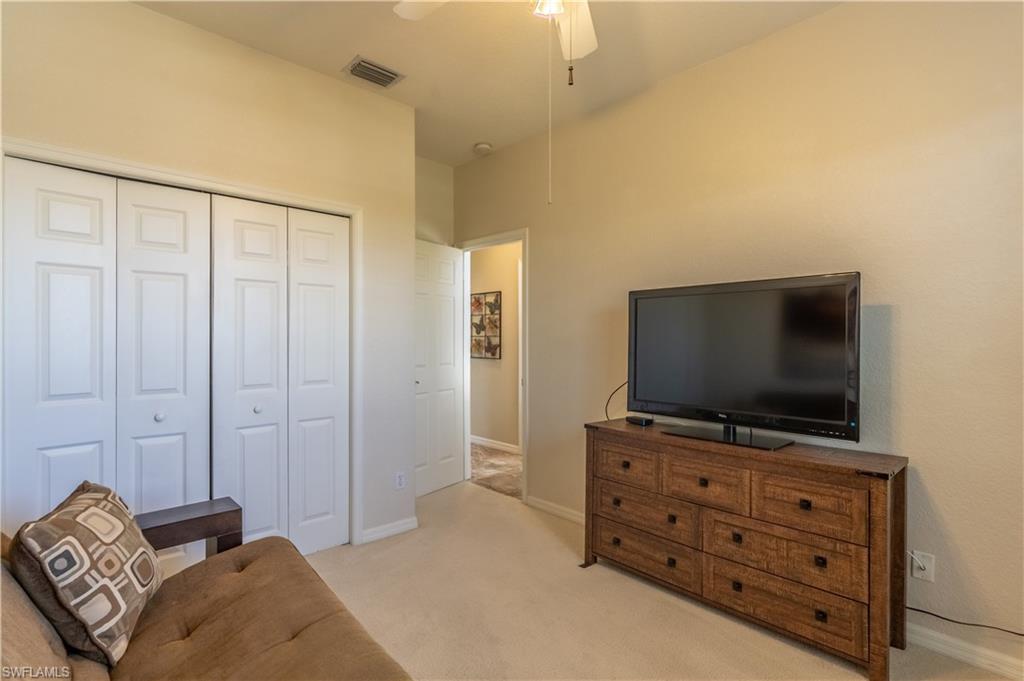 749 Crossfield Circle Naples, FL 34104 - Photo 19 of 37 a living room with furniture and flat screen tv