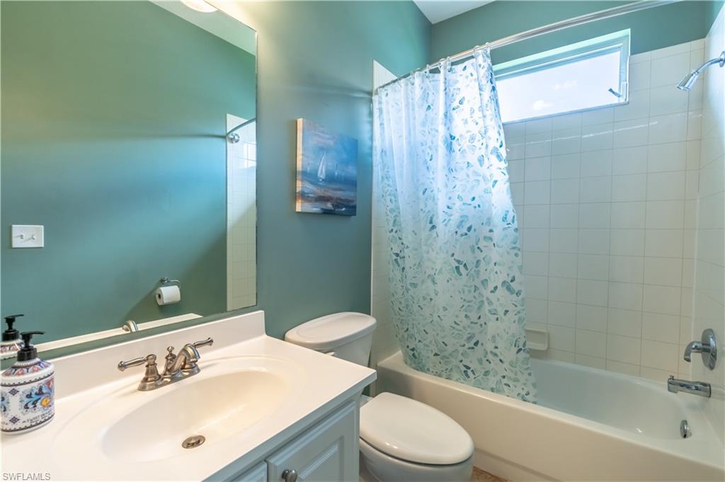 749 Crossfield Circle Naples, FL 34104 - Photo 20 of 37 a bathroom with a sink a toilet and shower