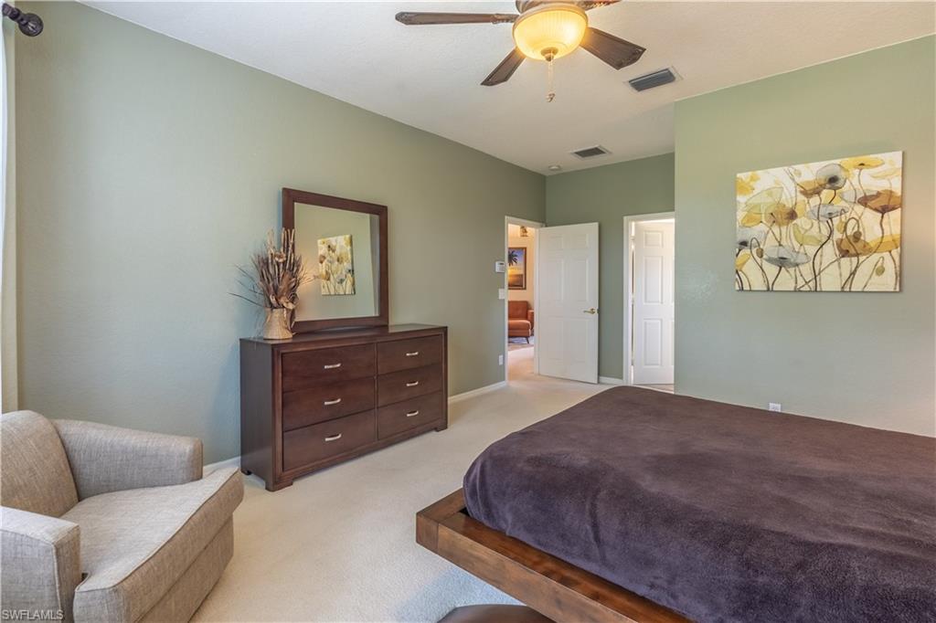 749 Crossfield Circle Naples, FL 34104 - Photo 25 of 37 a bedroom with a bed and window
