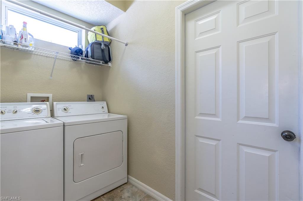 749 Crossfield Circle Naples, FL 34104 - Photo 27 of 37 a utility room with dryer and washer
