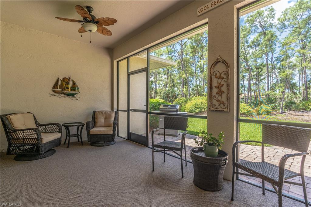 749 Crossfield Circle Naples, FL 34104 - Photo 29 of 37 a living room with furniture and a window