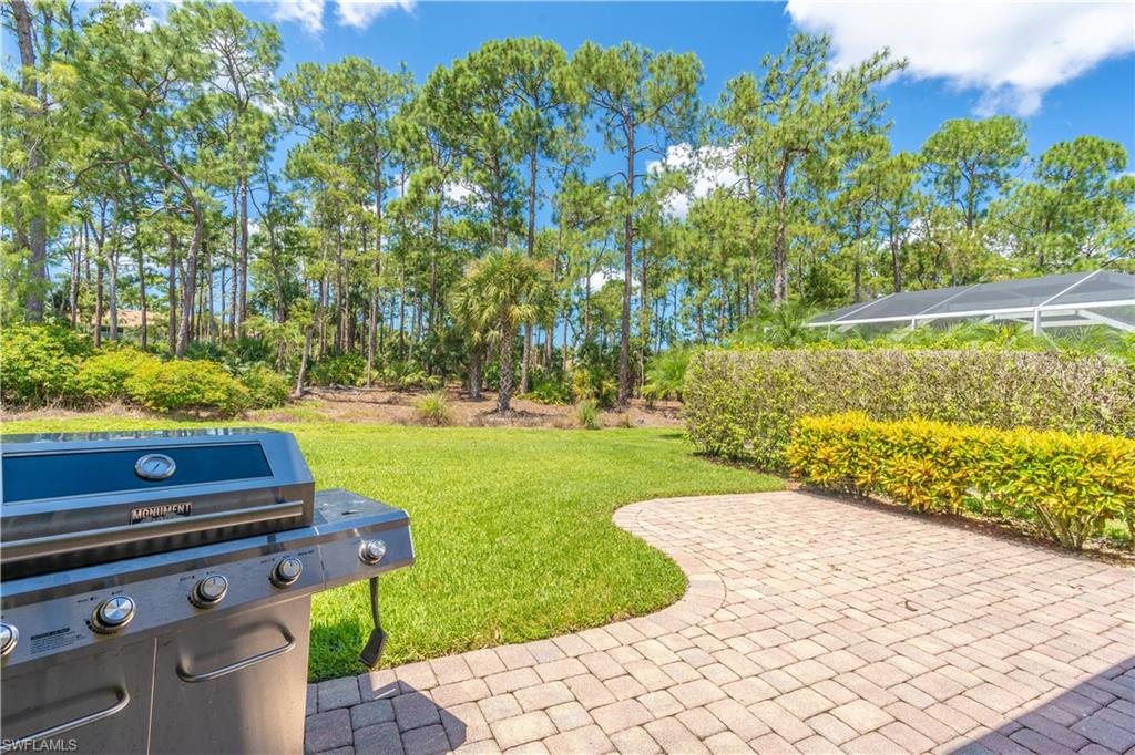 749 Crossfield Circle Naples, FL 34104 - Photo 31 of 37 a view of a yard with an outdoor space