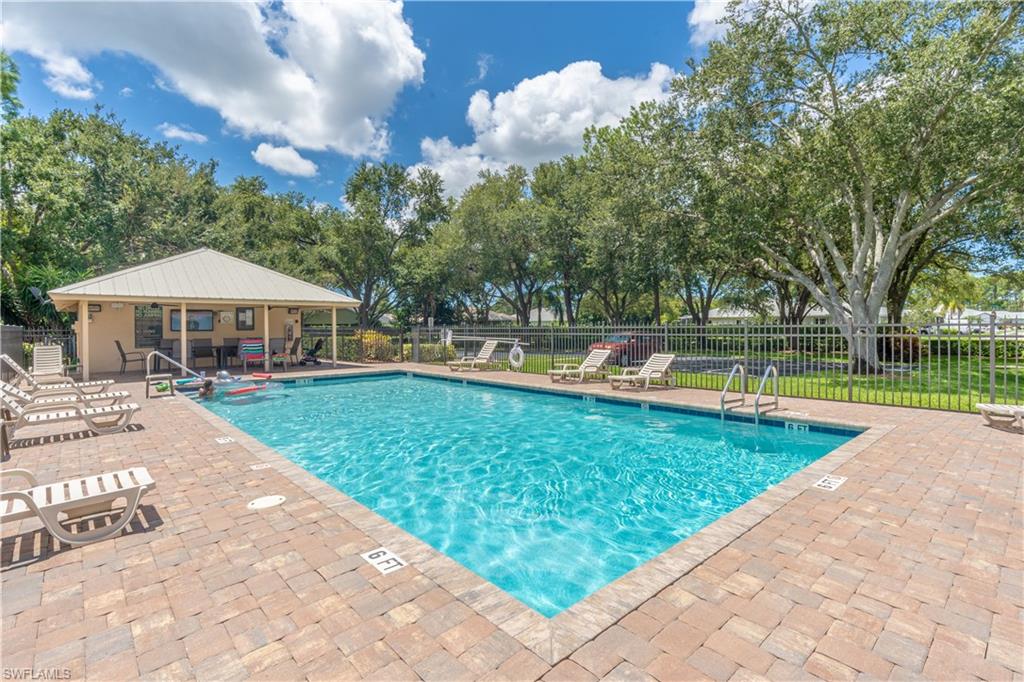 749 Crossfield Circle Naples, FL 34104 - Photo 34 of 37 a view of a house with a yard