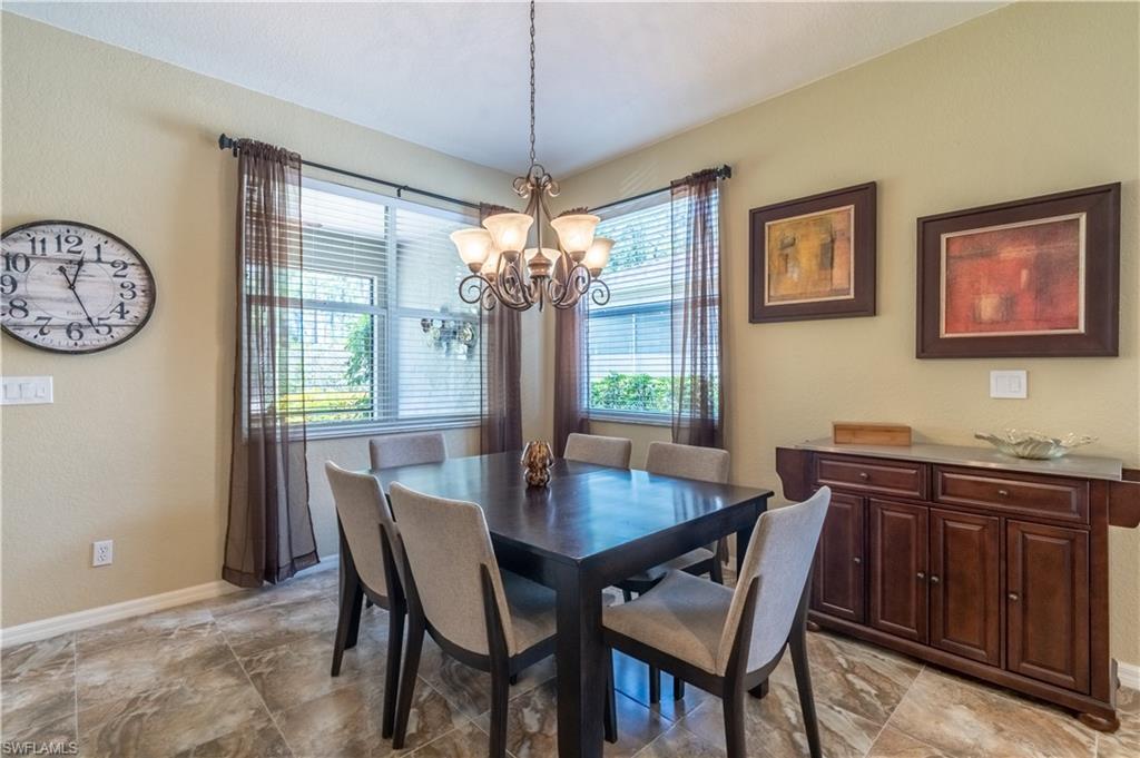 749 Crossfield Circle Naples, FL 34104 - Photo 10 of 37 a view of a dining room and a table and chairs
