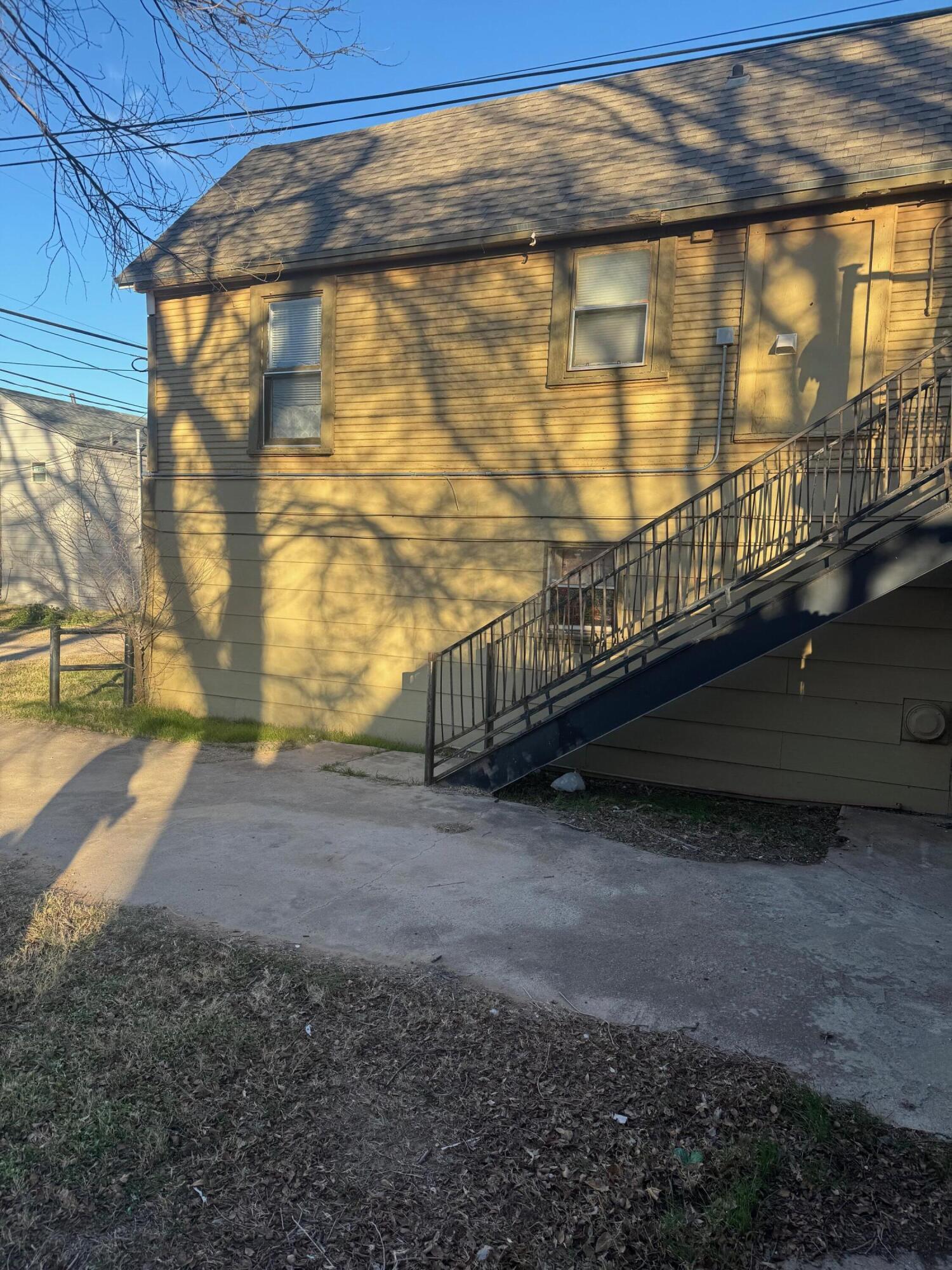 2312 15th Street Lubbock, TX 79401 - Photo 14 of 20 a view of a pathway with a yard