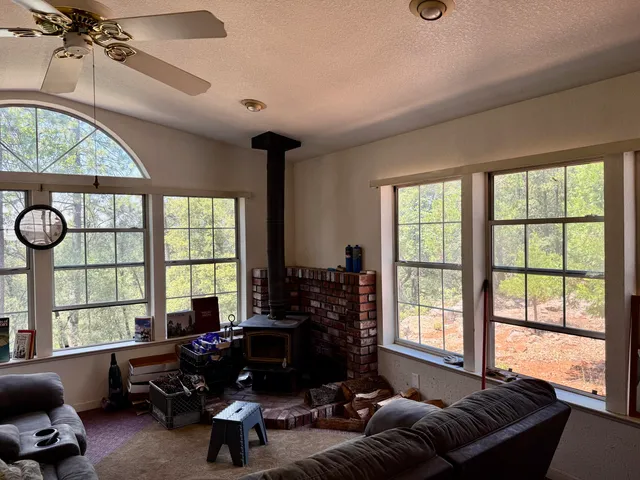 a living room with furniture and a large window