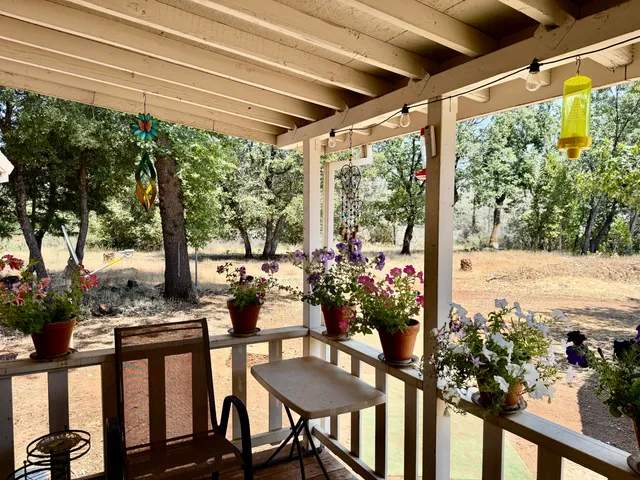 a view of a chairs and table in the patio