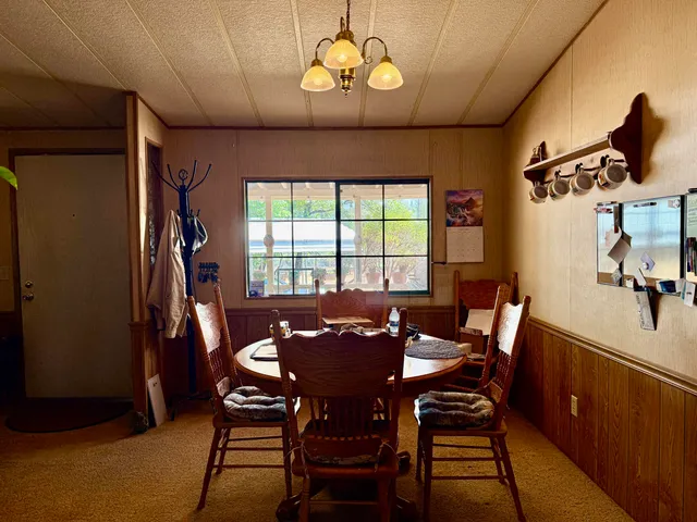 a view of a dining room with furniture and window