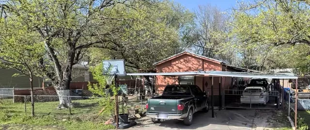 a view of a car park in front of house
