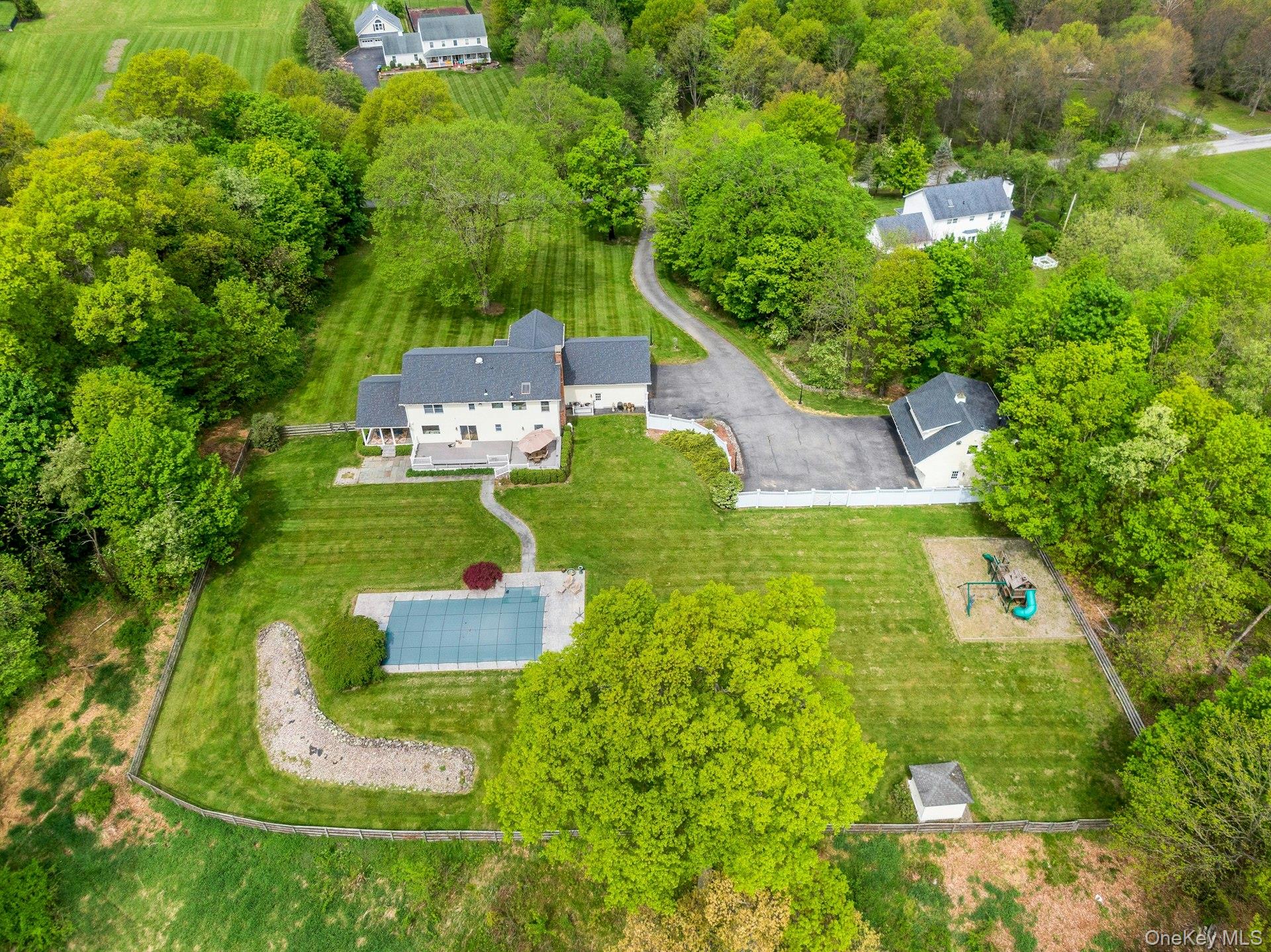 97 Moffat Road Washingtonville, NY 10992 - Photo 1 of 48 an aerial view of a house with a yard basket ball court and outdoor seating