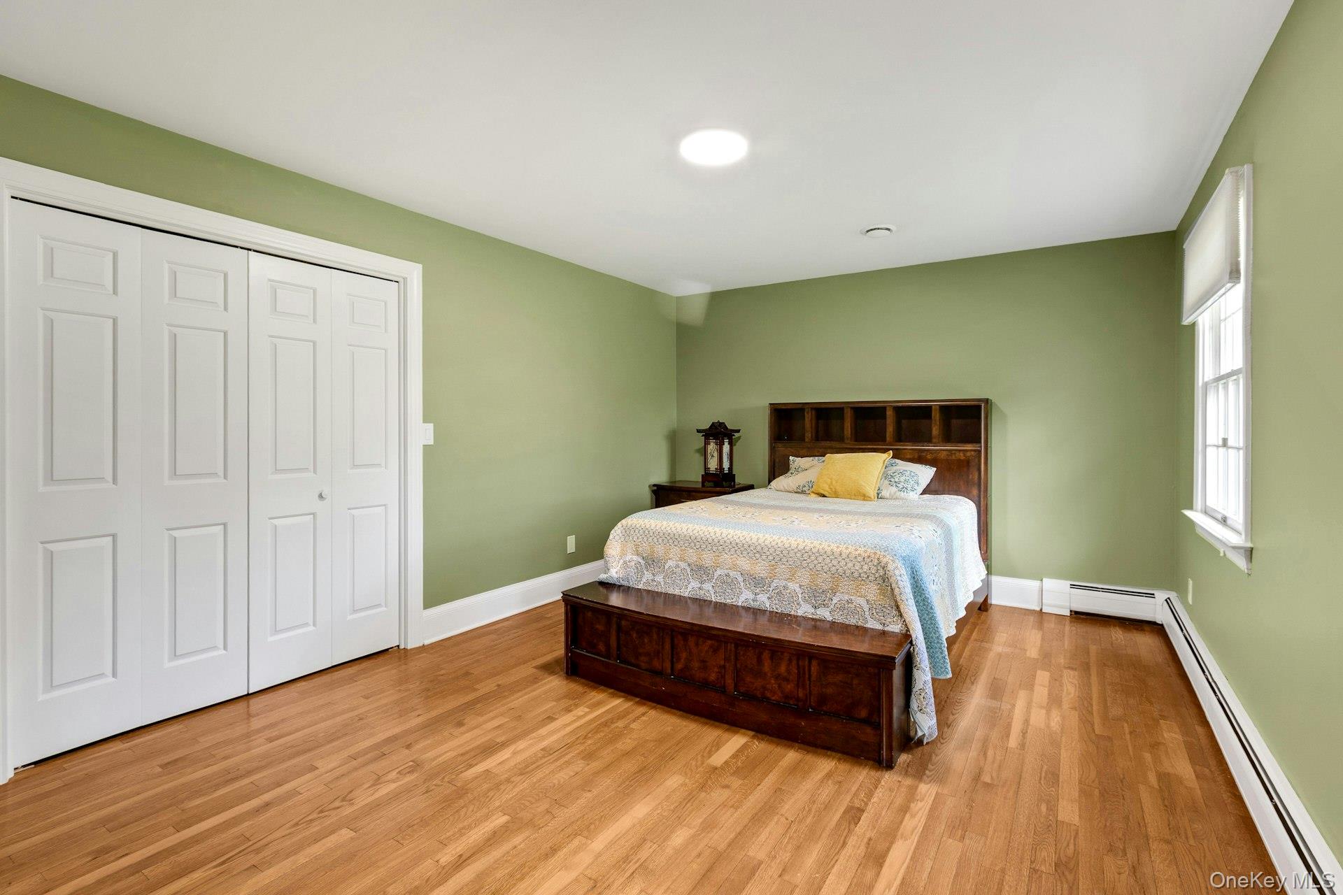 97 Moffat Road Washingtonville, NY 10992 - Photo 35 of 48 a bed sitting in a room next to a window