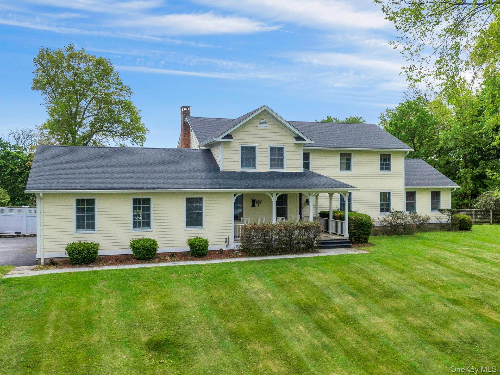 97 Moffat Road Washingtonville, NY 10992 - Photo 5 of 48 a front view of a house with a garden and trees