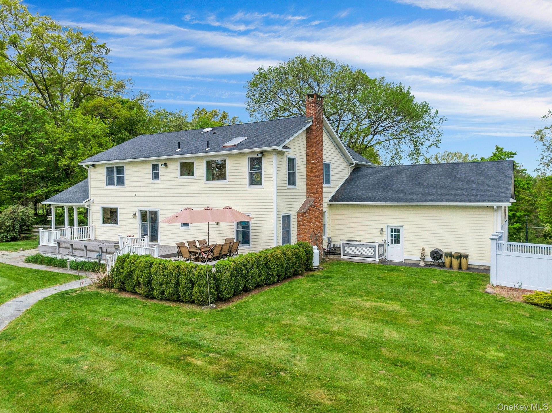 97 Moffat Road Washingtonville, NY 10992 - Photo 8 of 48 a view of a house with a big yard potted plants and large tree