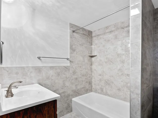 a bathroom with a sink and a bathtub