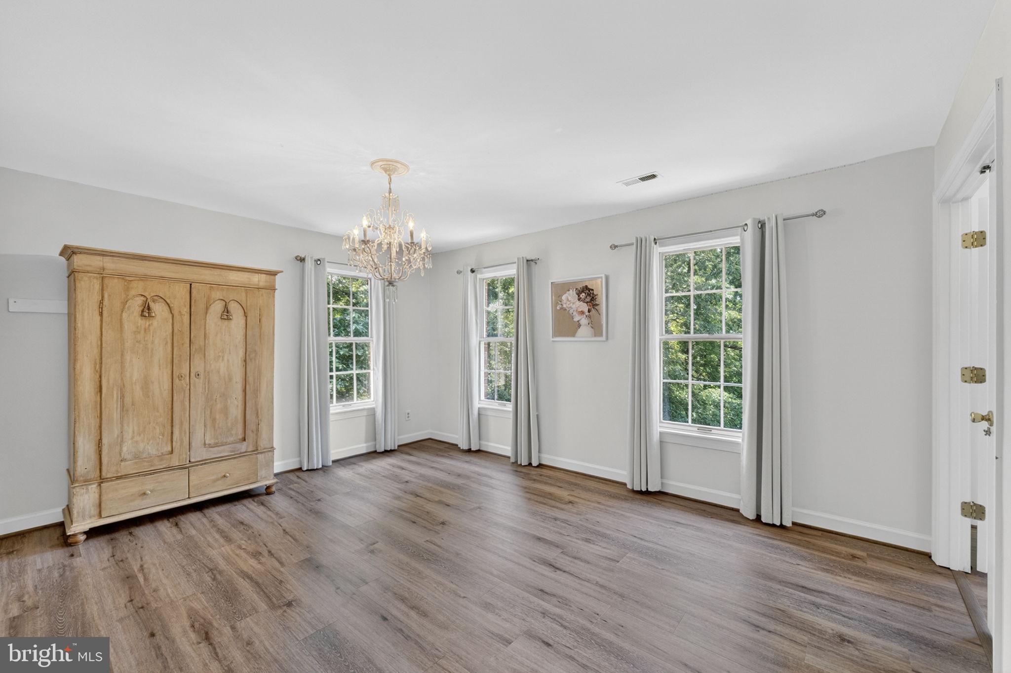 4531 Den Haag Road Warrenton, VA 20187 - Photo 57 of 103 an empty room with wooden floor cabinet and windows