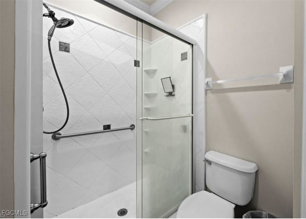 14970 Vista View Way, Unit 304 Fort Myers, FL 33919 - Photo 12 of 37 a bathroom with a toilet and a shower