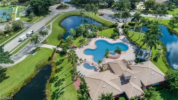 a view of a swimming pool with a patio