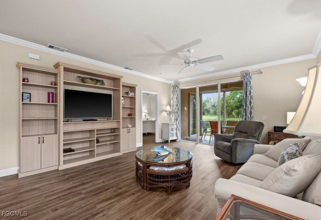 14970 Vista View Way, Unit 304 Fort Myers, FL 33919 - Photo 7 of 37 a living room with furniture and a flat screen tv
