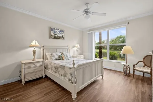 a bed room with bed and window