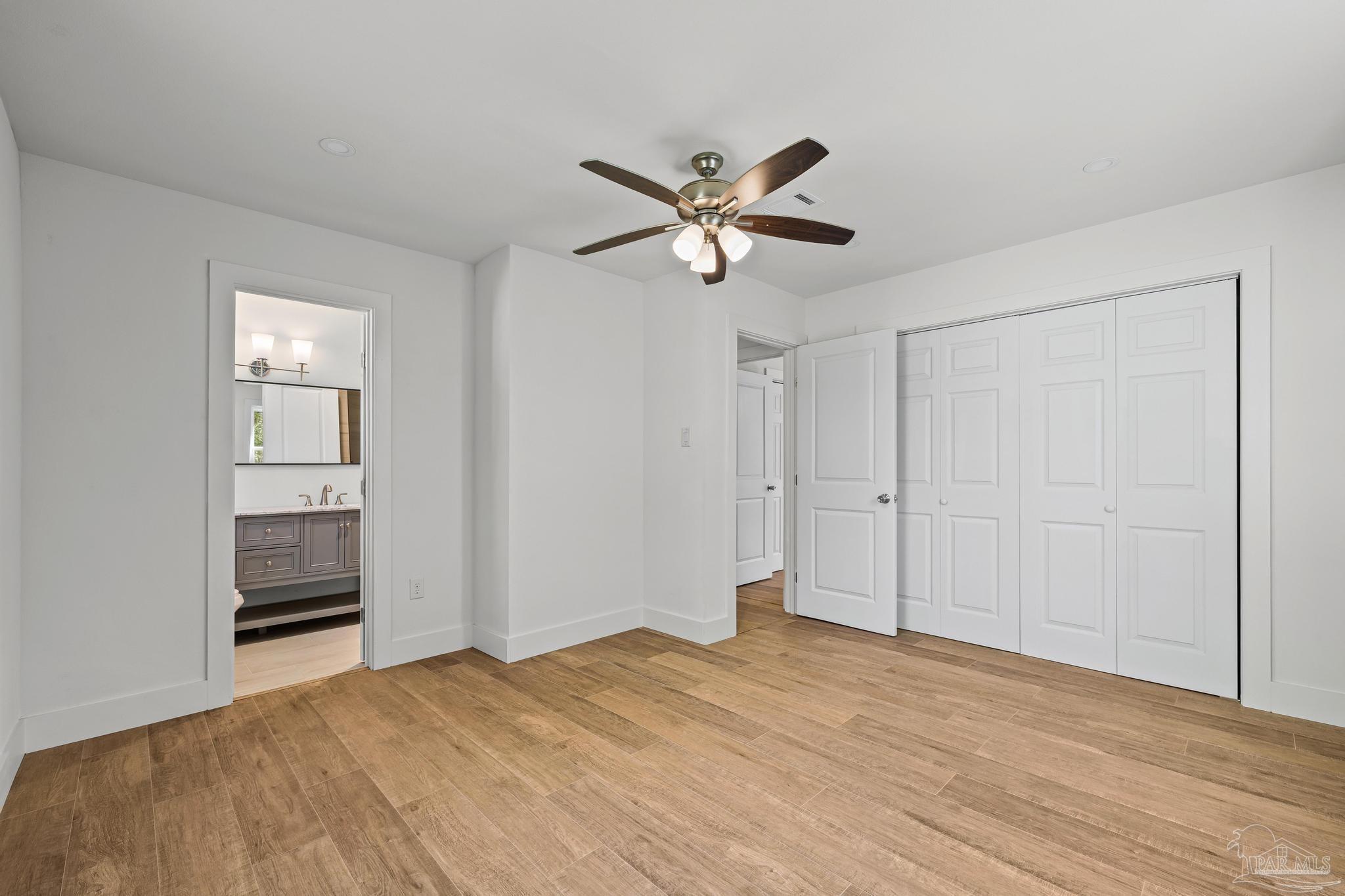 7988 Malone Road Milton, FL 32570 - Photo 28 of 69 a view of empty room with a ceiling fan and a window