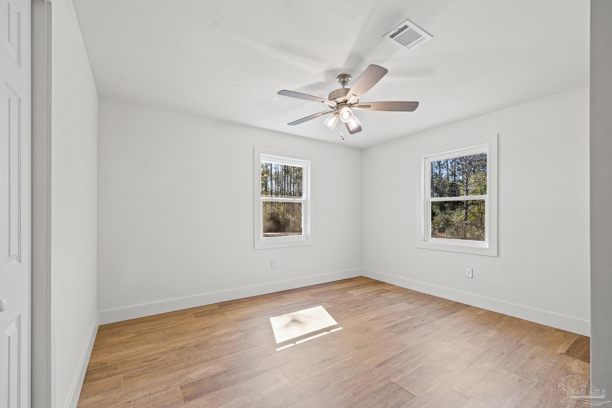 7988 Malone Road Milton, FL 32570 - Photo 36 of 69 an empty room with a window