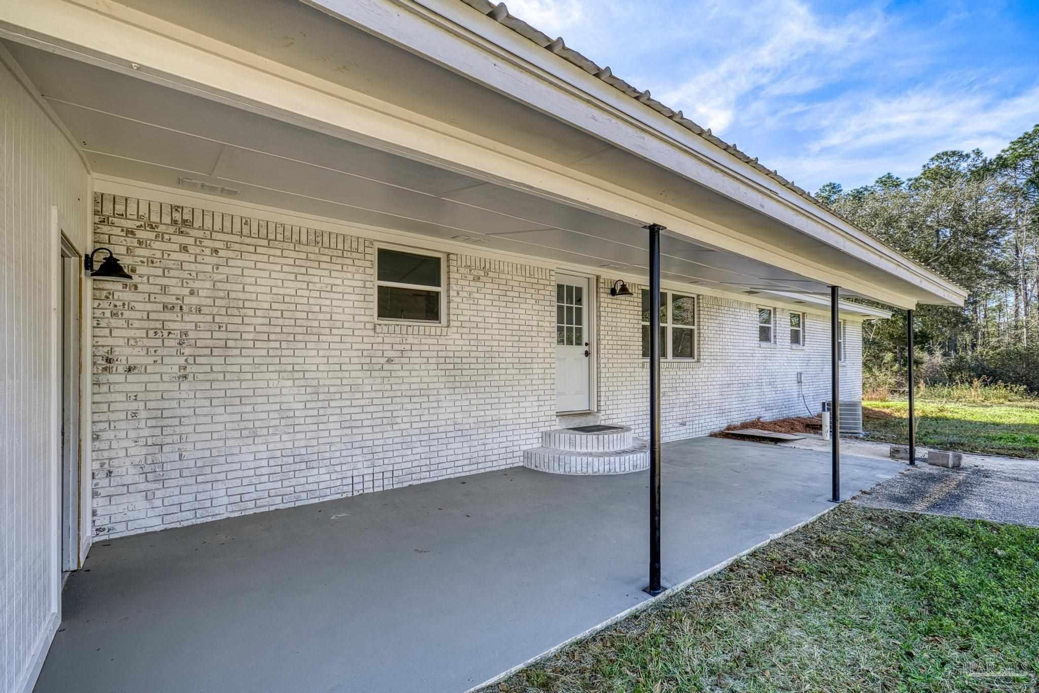 7988 Malone Road Milton, FL 32570 - Photo 38 of 69 a view of a house with backyard