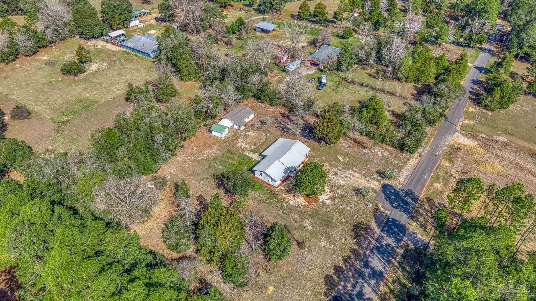 7988 Malone Road Milton, FL 32570 - Photo 54 of 69 an aerial view of residential house with outdoor space