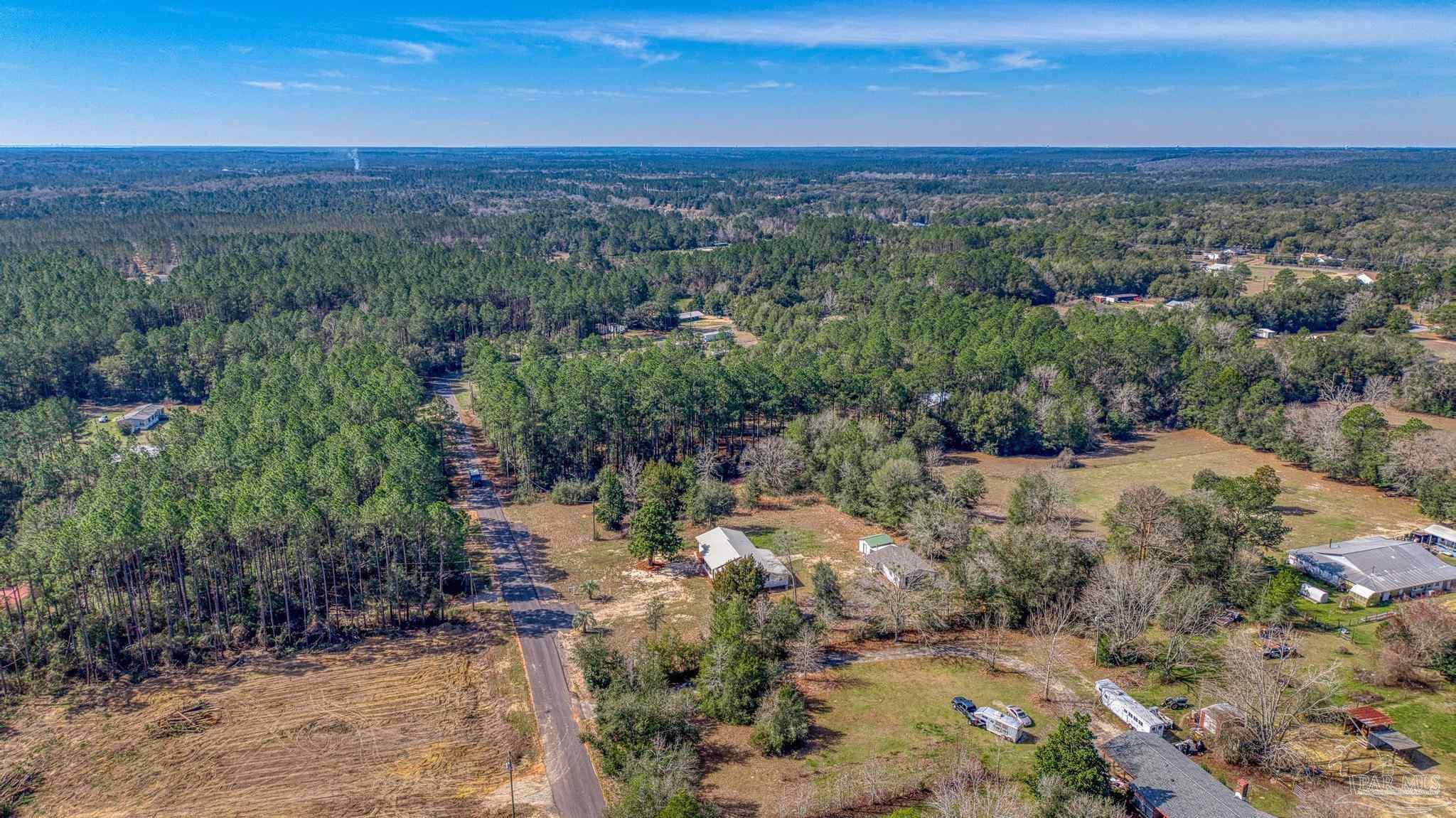 7988 Malone Road Milton, FL 32570 - Photo 58 of 69 an aerial view of a houses with a yard