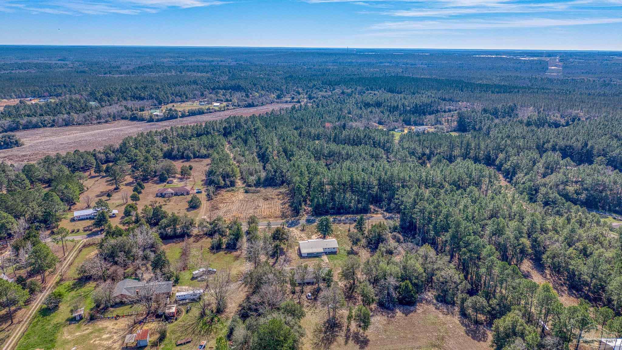 7988 Malone Road Milton, FL 32570 - Photo 60 of 69 an aerial view of residential house and outdoor space