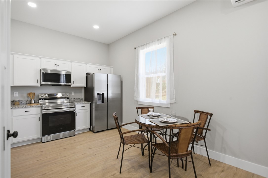 216 South Stribling Street Seneca, SC 29678 - Photo 15 of 38 This bright kitchen features modern appliances and a comfortable dining area.