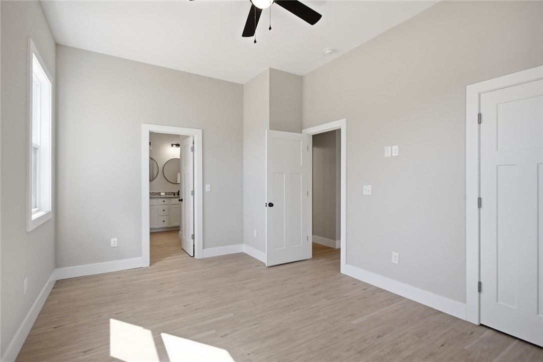 216 South Stribling Street Seneca, SC 29678 - Photo 18 of 38 This spacious bedroom offers ample natural light and access to a private bathroom.