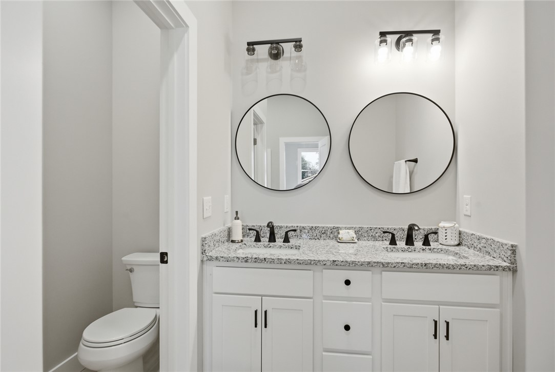 216 South Stribling Street Seneca, SC 29678 - Photo 21 of 38 This bathroom features a double vanity with ample counter space and modern fixtures.