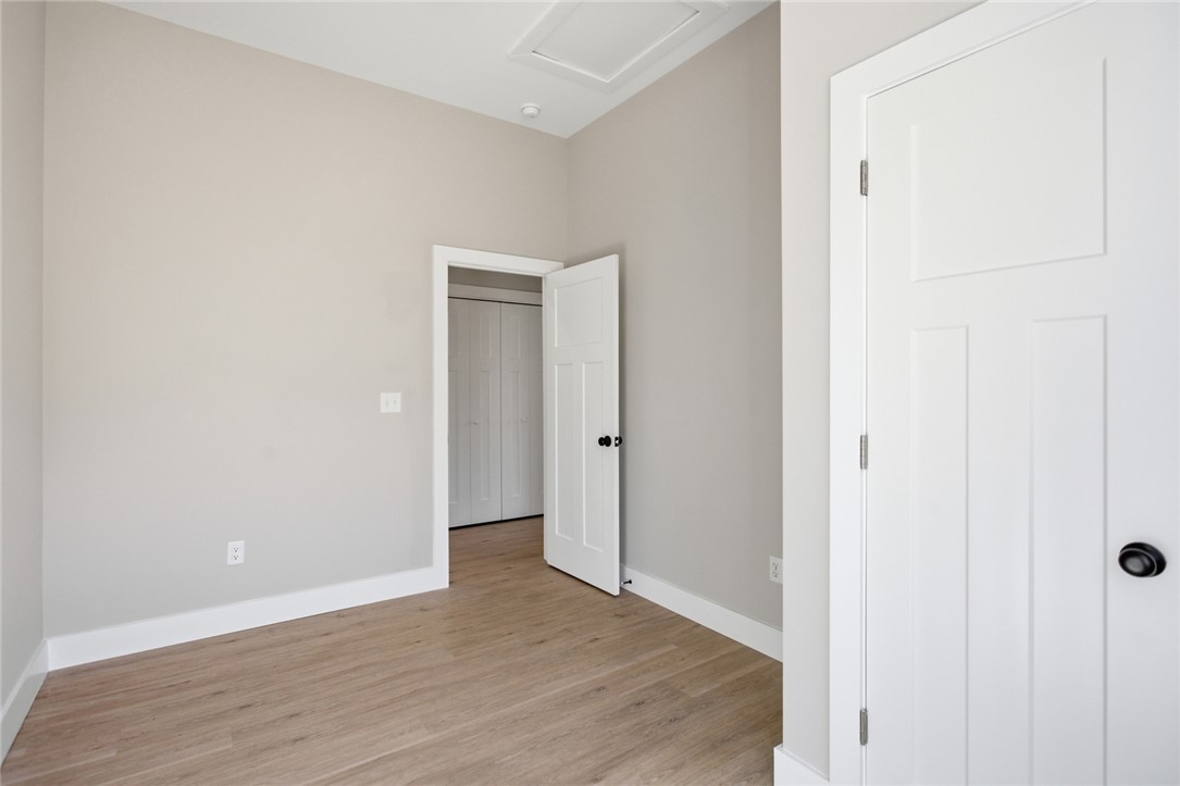 216 South Stribling Street Seneca, SC 29678 - Photo 24 of 38 An inviting room boasts warm wood flooring and clean, minimalist doors.