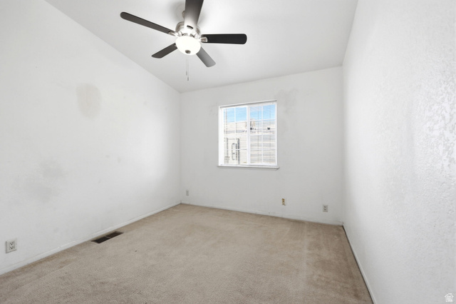 2491 Highway 89, Unit 614 Pleasant View, UT 84404 - Photo 17 of 27 Carpeted room featuring a ceiling fan with integrated lighting, a double-paned window, and white textured walls