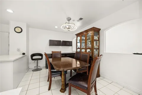 a view of a dining room with furniture and window