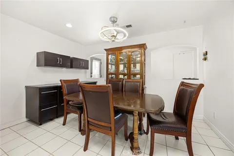 a view of a dining room with furniture and a window