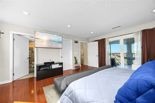 a bathroom with a double vanity sink toilet and shower