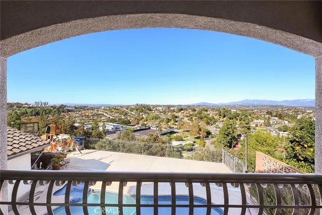 a living room with lots of furniture and a bookshelf