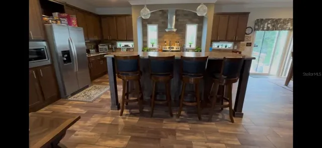 a room with furniture and potted plant