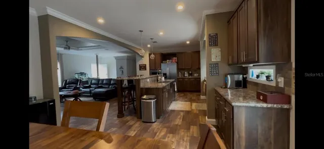 a kitchen with a sink appliances and cabinets