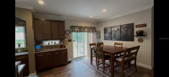 a kitchen with stainless steel appliances a refrigerator and wooden cabinets