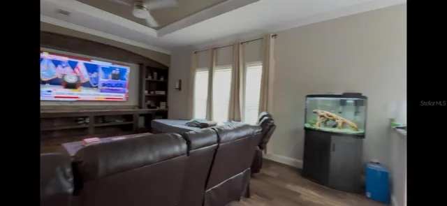 a room with furniture and a flat screen tv