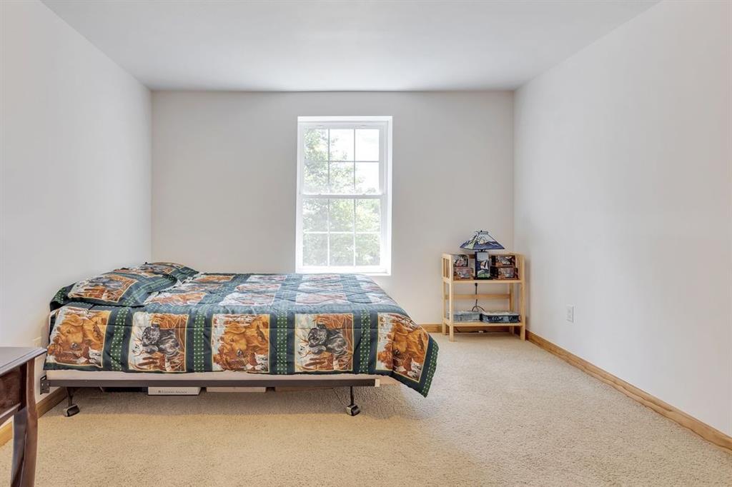 1130 Ridge Road Templeton, PA 16259 - Photo 17 of 25 a bedroom with a bed and a window