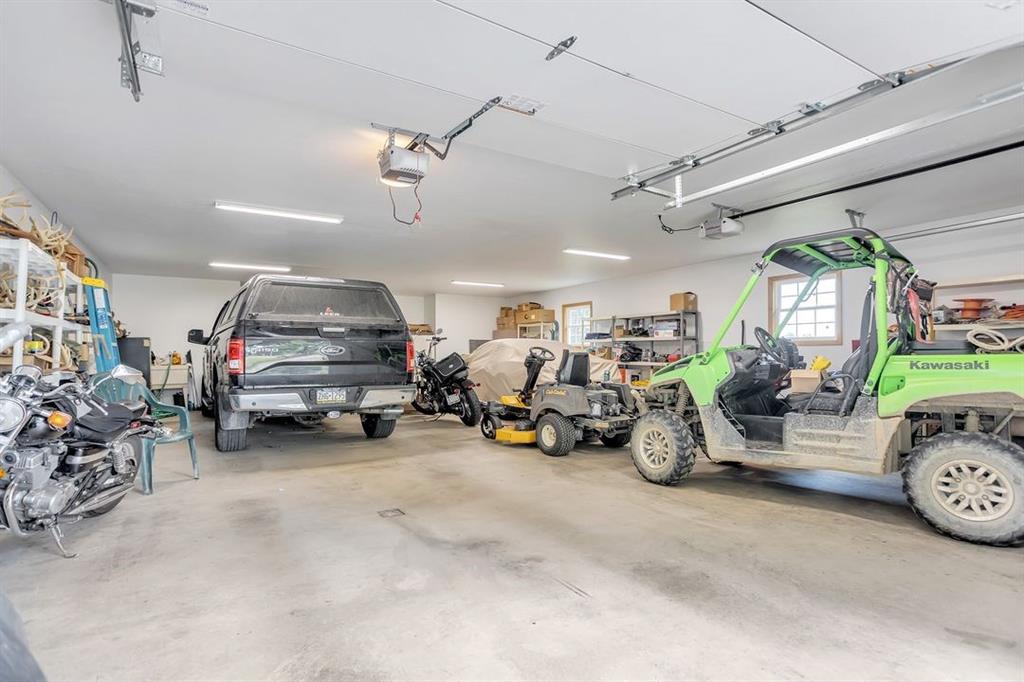 1130 Ridge Road Templeton, PA 16259 - Photo 19 of 25 a view of a garage with a bike and a car